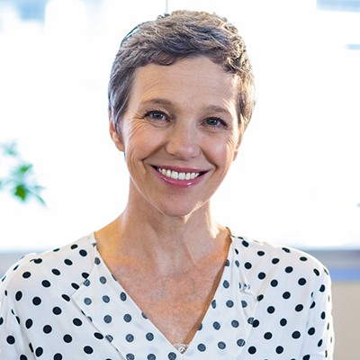 Tysons implant-assisted dentures (i.e., overdenture) woman smiling