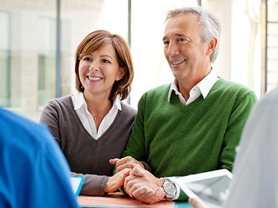 husband and wife receiving dental consultation